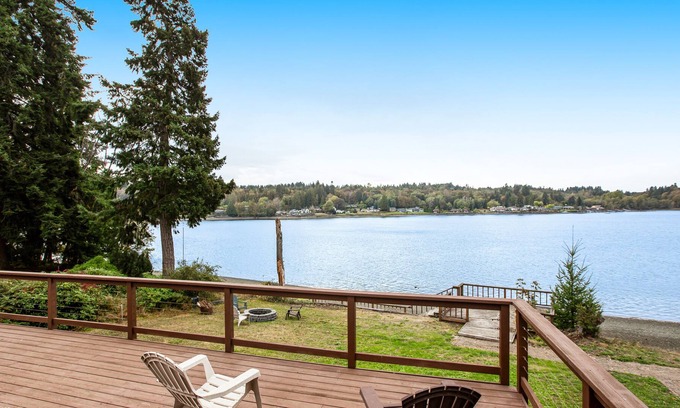Agate House | Vibrant waterfront home with large deck, woodstove & striking sunset views