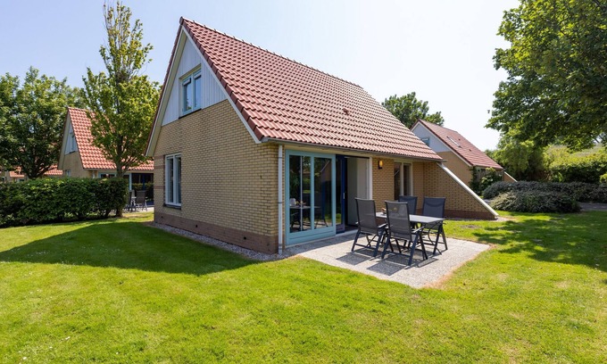 Andijk House | Villa in Friesland with Garden by Water