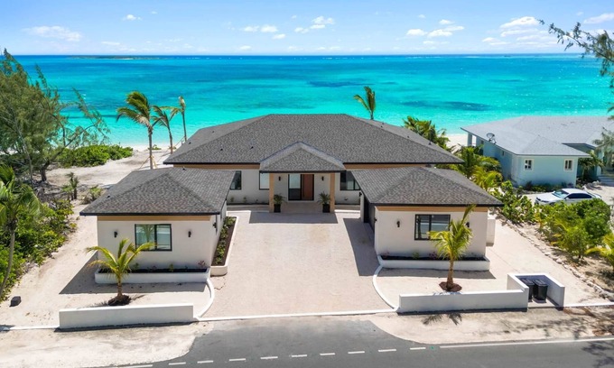 Tar Bay Villa | Villa Summerwinds, , Beachfront on Flamingo Bay, Heated Pool + Carriage Home.