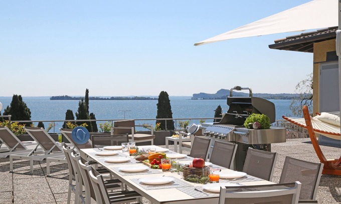 Gardone Riviera Villa | Villa surrounded by greenery with splendid lake view.