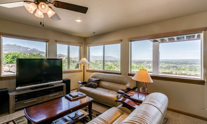 Southwest Colorado Springs Apartment | WALLS OF GLASS! Mountain top apartment, panoramic mt. views and city lights.