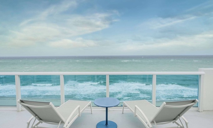 Central Beach Hotel | Warm and Inviting Beach Room with Private Balcony Overlooking the Marina