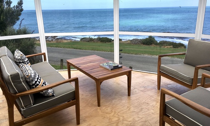Kakanui House | Watch the weather roll in along the coast with sea views from every room.