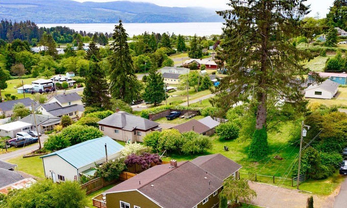 Bay City House | Water view retreat with scenic deck, grill, yard, fireplace, board games, & W/D