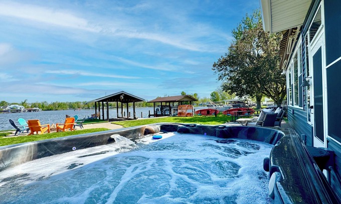 Russells Point Cabin | Waterfront Cabin with Hot Tub, Outside Bar & Private Dock!