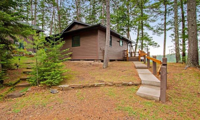 Sayner Condo | Waterfront cabin with Plum Lake views, private dock, beach access & kayaks