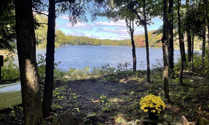 Bliss RV Rental | Waterfront camper in Adirondack-like setting
