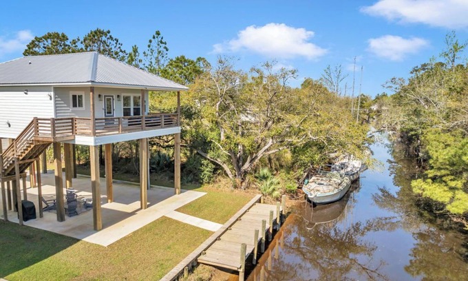 Shoreline Park House | Waterfront Escape in Bay STL with dock, ping pong, basketball, cornhole & more!
