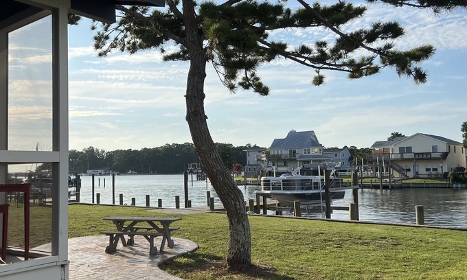 Colington Harbour Cottage | Waterfront Harbor Home, Sunset Views, Fireplace, Private dock and Boat Slip