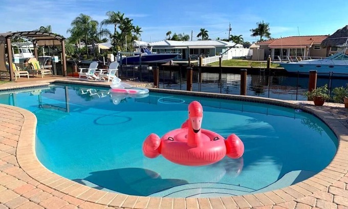 Garden Isles House | Waterfront Home, Large Heated Pool, 5 min. from the beach, family friendly