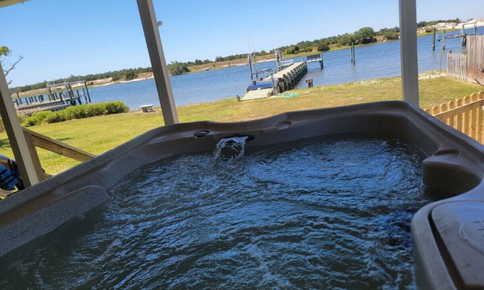 Cedar Point House | Waterfront home with Private Dock, 3 miles to Beach, Hot tub, kayaks, and swimming area, large fenced backyard, pet friendly