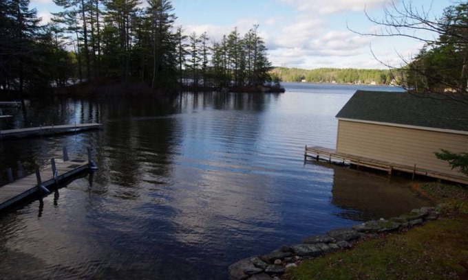Sunapee House | Waterfront property on pond with private dock .