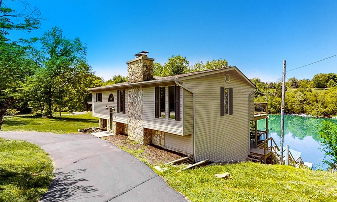 Rock Harbor Cabin | Waterfront retreat w/deck, wood fireplace, gas grill, lake views, gas grill, W/D