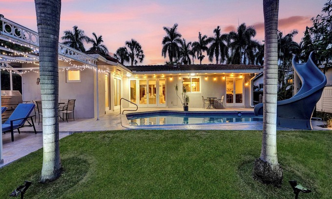 Coral Ridge Isles House | Waterfront Serenity. Pool & BBQ. Koi Pond