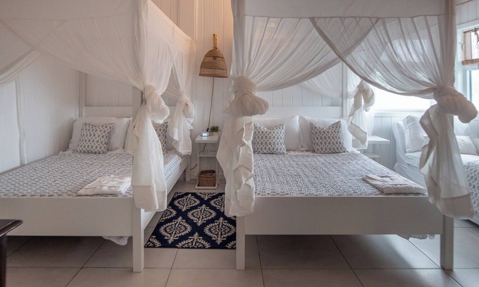Liberta Villa | Waterfront Spacious 5-bedroom villa in Mamora Bay,Watersports Games room,