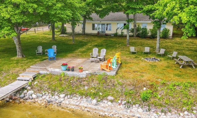 Central Lake Cottage | Waterfront Torch Lake Cottage w/Dock & Fire Pit!