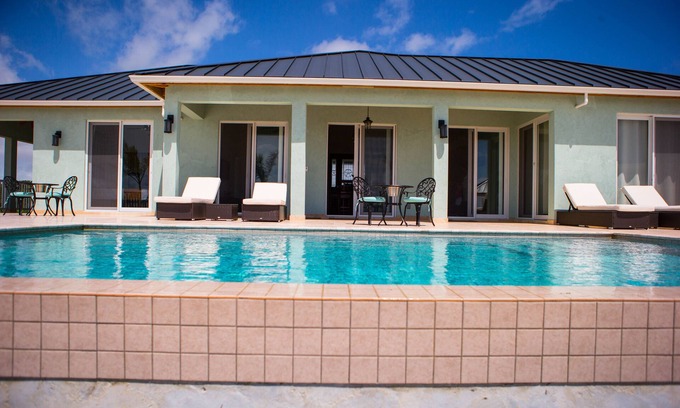 Bottle Creek Villa | Waterfront Villa 3 bedroom main house &1 bed guesthouse with compact rental car
