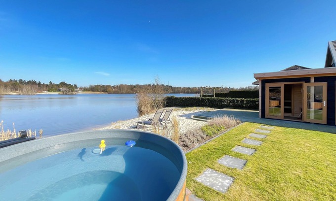 Westerhaar-Vriezenveensewijk House | Wellness house by the water with sauna, hot tub, and private beach