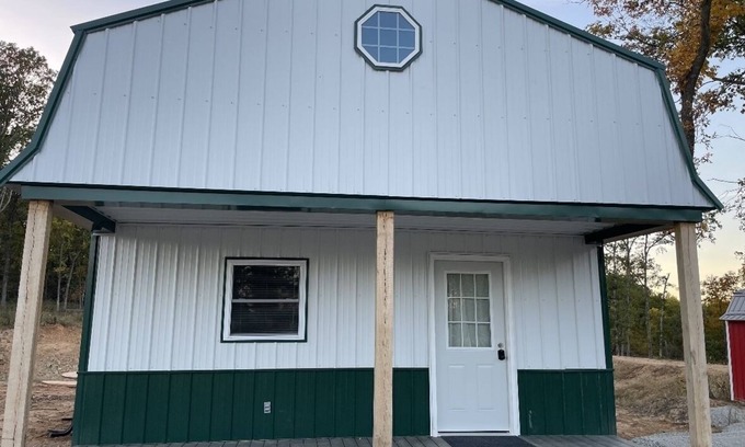 Johnson County Cabin | White cabin in the woods close to Univ. of Central Missouri and Whiteman AF Base