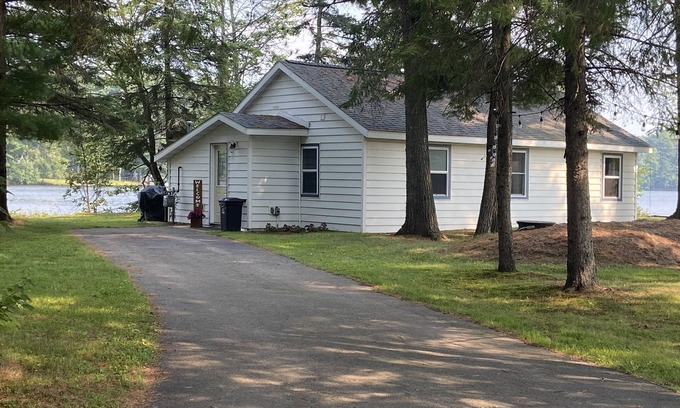 Rhinelander Cottage | WI River-Boom Lake cottage on spacious lot, water on 3 sides, kayaks, fire pit