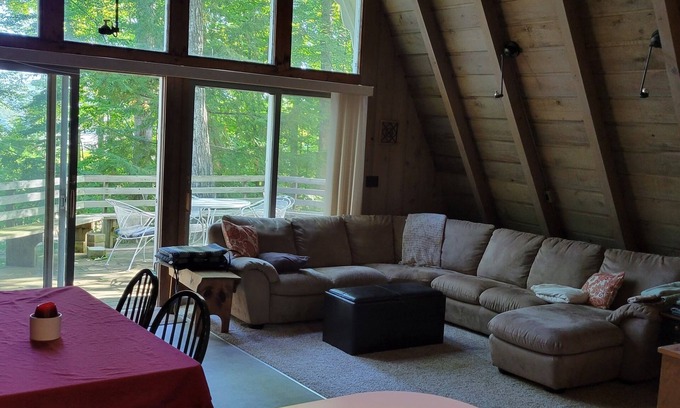 Boyne City Ski Chalet | Wooded setting with view of Walloon Lake