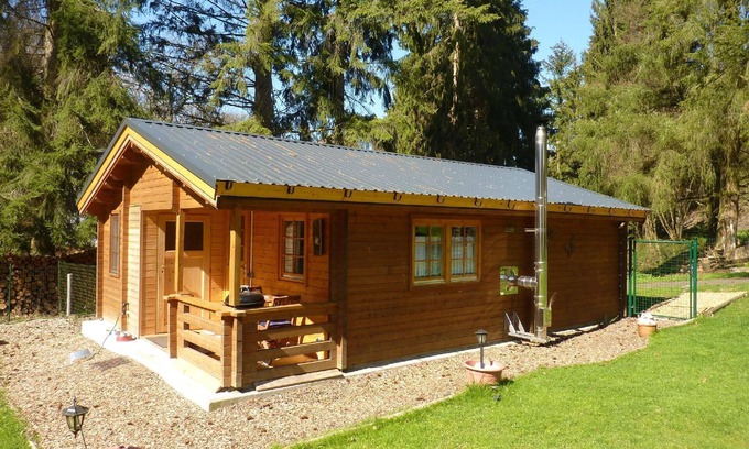 Beltheim House | Wooden cabin is situated right by the forest, with the Deimerbach stream meandering past the fully fenced site