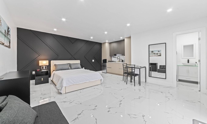 Richmond West Apartment | XL Luxury Room. Luxurious studio retreat with sleek designs.