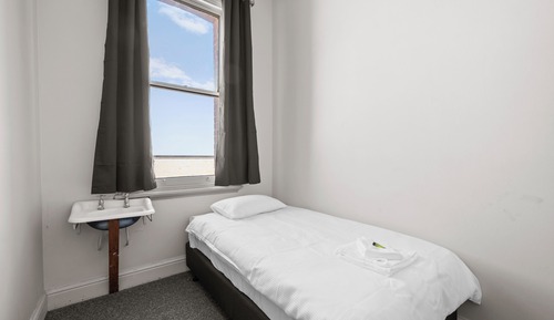 Basic Single Room, 1 Twin Bed, Shared Bathroom