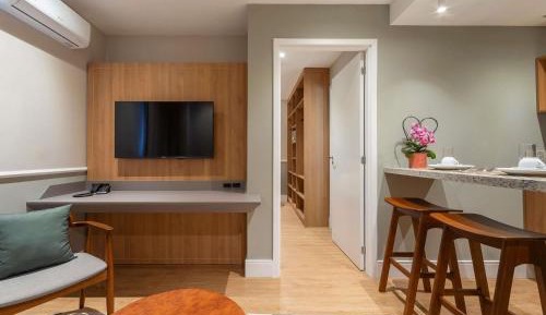 Executive Room with a Queen Bed and a Sofa