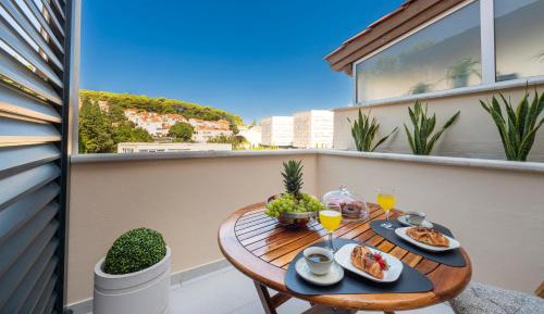 One-Bedroom Apartment with Balcony and City View