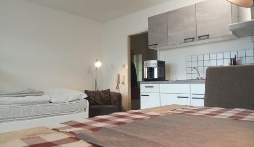 One-Bedroom Apartment with Balcony and City View