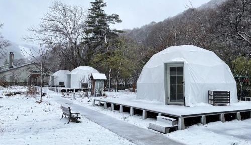 Left Side Glamping Dome with brown sofa