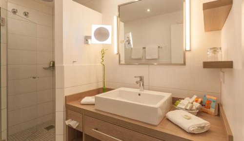 Suite with Balcony and Side View of the Sea