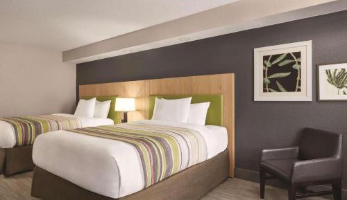 Premium Queen Room with Two Queen Beds and Balcony - Non-Smoking