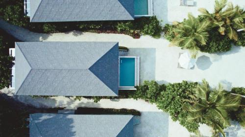 Dheru Beach Pool Villa| Complimentary Return Seaplane Transfer for 2 Adults with min 9-nights stay. Applicable for bookings made from 18th August, 2025, stay period till 26th Dec, 2025