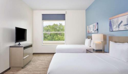 Queen Room with Two Queen Beds, Sofa Bed and Shower - Disability Access