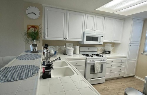 Airport Area Apartment | comfortable bedroom with blackout curtains for sound sleep