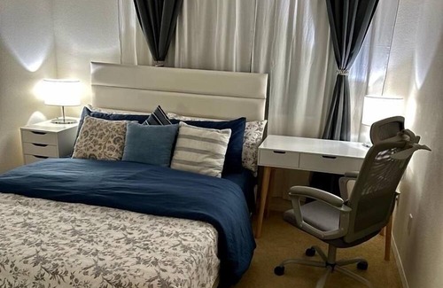 Airport Area Apartment | comfortable bedroom with blackout curtains for sound sleep