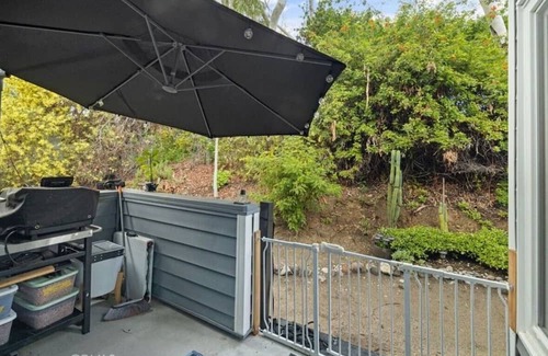 Lake Forest Condo | A Spacious room with artistic design and a bidet in the forest.