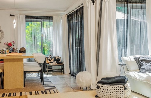 Lake Forest Condo | A Spacious room with artistic design and a bidet in the forest.