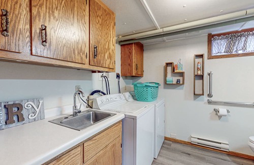 Hazelhurst House | Lakefront home with large patio, fire pit, air hockey & a provided peddle boat