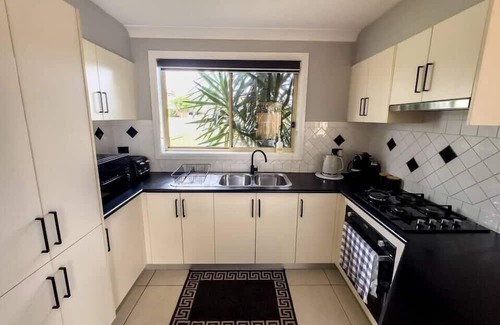 Prestons House | KozyGuru | Prestons Dream Holiday House + Parking