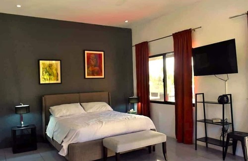 Dauin Villa | overlooking villa with breathtaking sunrises a modern kitchen big swimming pool