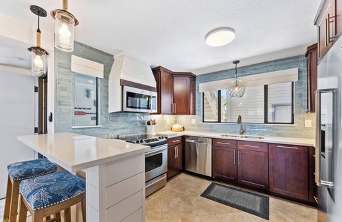 Bethune Beach Condo | Riverfront / Boat Dock / Pool / Walk to Beach / Cedar Island Club