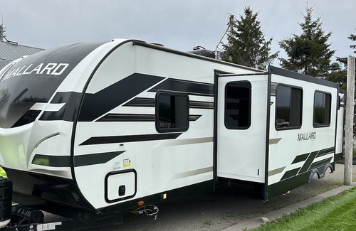 Mosinee House | Waterside Campsite with camper. Pet friendly!