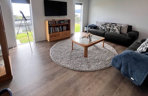 Cable Bay House | Above The Rest is positioned perfect with a view across the bay.