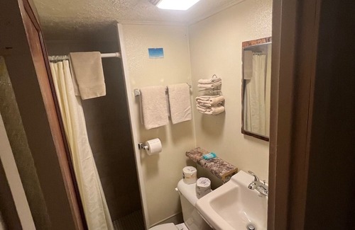 Onalaska House | Overlooking Lake Onalaska--Private Bedroom/Bathroom; fish cleaning room onsite