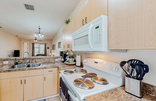 Haines City House | Townhouse near the lake with outdoor pool, hot tub, patio, streaming, W/D, & AC