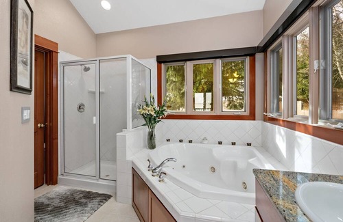 Sandpoint House | Waterfront home with private dock, beach, hot tub & wrap-around deck
