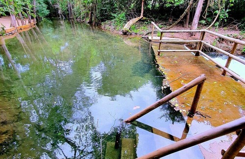 Pousada do Rio Quente Apartment | Resort Park Veredas with the warm river in the background